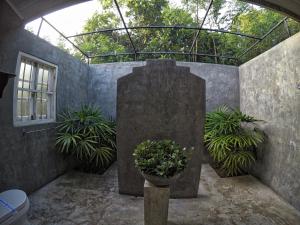 a courtyard with plants and a glass roof at The Horizon Hill Top Villa in Unawatuna