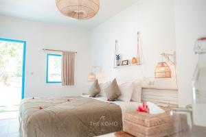 Voodi või voodid majutusasutuse The Koho Air Hotel toas