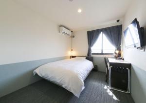Postel nebo postele na pokoji v ubytování Hotel Taiyo Nouen Furumitsu + 37 fotografií