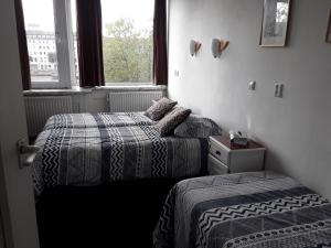 Postel nebo postele na pokoji v ubytování Hotel Baan
