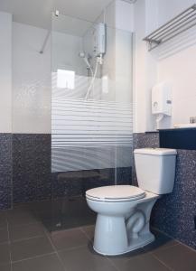 a bathroom with a toilet and a shower at Don Mueang Place Hotel in Bangkok +25 photos