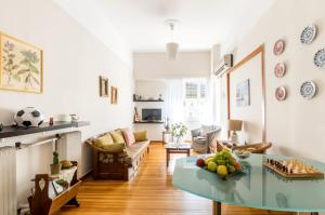 a living room with a table with fruit on it at Beautiful appartment under Akropolis! in Athens