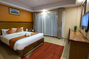 Ένα ή περισσότερα κρεβάτια σε δωμάτιο στο Hotel Lake Star