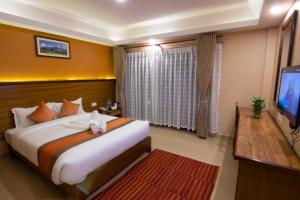 Ένα ή περισσότερα κρεβάτια σε δωμάτιο στο Hotel Lake Star