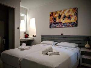 Posteľ alebo postele v izbe v ubytovaní Boutique Rooms "O"