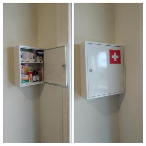 a refrigerator with a red cross on the side of it at Boutique Rooms "O" in Orchomenós