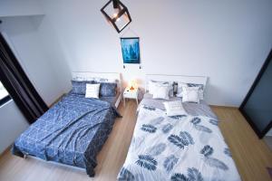 Postel nebo postele na pokoji v ubytování Gt Home encorp strand residence (alpha ivf )