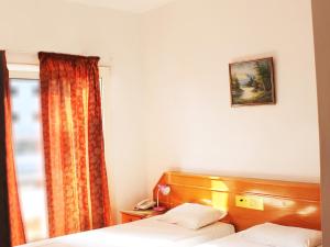 Postel nebo postele na pokoji v ubytování Rebioz Hotel