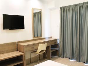 TV a/nebo společenská místnost v ubytování Rebioz Hotel + 20 fotografií