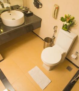 a bathroom with a toilet and a sink at Fortune Park JP Celestial, Bengaluru - Member ITC's Hotel Group in Bangalore