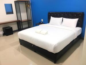 Uma cama ou camas num quarto em K2Green Hotel
