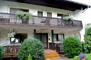 a house with flowers on the balconies at Haus Sonnenschein in Mespelbrunn