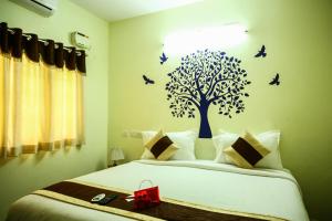 Postel nebo postele na pokoji v ubytování OYO Apartment T Nagar Near Guindy National Park