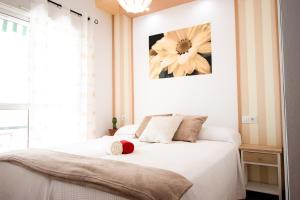 A bed or beds in a room at Summerland Apartments Rota
