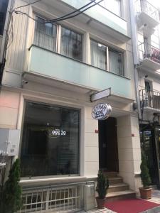 a store front of a building with a sign on it at Beyhan Hotel in Istanbul