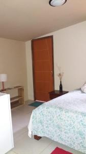 מיטה או מיטות בחדר ב-Casa da Marluce