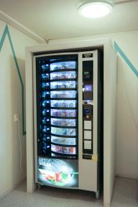 a refrigerator with food inside of a room at Citysleep in Luleå