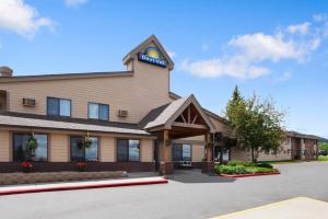 a front view of a hotel with a parking lot at Days Inn by Wyndham Helena in Helena