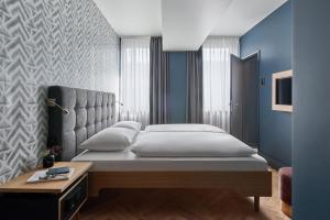Postel nebo postele na pokoji v ubytování Hotel MIO by AMANO