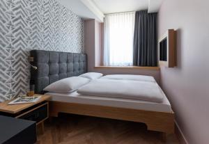 Postel nebo postele na pokoji v ubytování Hotel MIO by AMANO