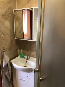 a bathroom with a sink and a mirror at Ubytovanie Poprad in Poprad
