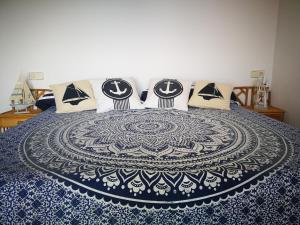 Łóżko lub łóżka w pokoju w obiekcie Las Alas del Mar.