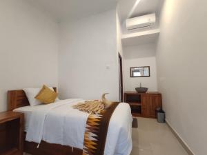 Postel nebo postele na pokoji v ubytování Gedhong Hostel