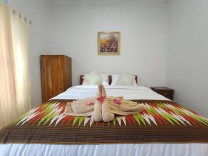 Postel nebo postele na pokoji v ubytování Gedhong Hostel