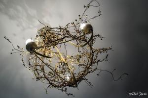 a chandelier with branches and lights in the sky at Chambres d'hôtes Le Pessac in Vielmur +16 photos