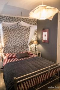 Cama o camas de una habitación en Chambres d'hôtes Le Pessac
