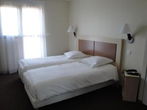 Кровать или кровати в номере Hotel Talencia