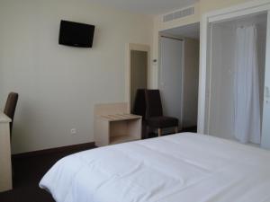 Voodi või voodid majutusasutuse Hotel Talencia toas