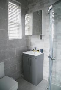 a bathroom with a sink and a toilet at 71 East Parade in Harrogate