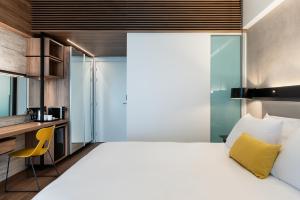 A bed or beds in a room at Euphoria Resort - All Inclusive