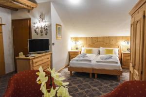 Säng eller sängar i ett rum på Hotel Relais Grünwald