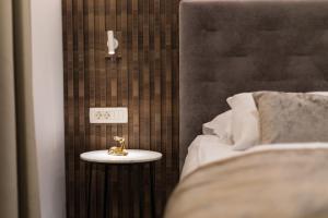 Postel nebo postele na pokoji v ubytování Garni Hotel Cirman