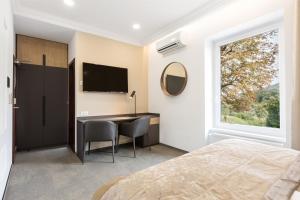 Postel nebo postele na pokoji v ubytování Garni Hotel Cirman