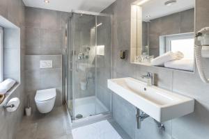 Koupelna v ubytování Garni Hotel Cirman