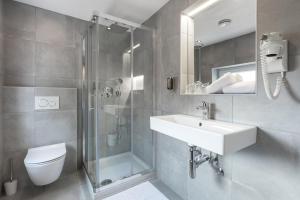 Koupelna v ubytování Garni Hotel Cirman