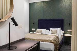 Postel nebo postele na pokoji v ubytování Garni Hotel Cirman + 37 fotografií