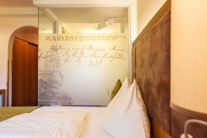Krevet ili kreveti u jedinici u okviru objekta Hotel Mariasteinerhof