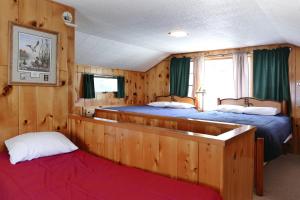 Postel nebo postele na pokoji v ubytování Bill Cody Ranch
