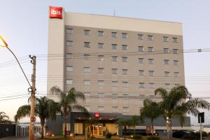 a hotel building with a sign on it at ibis Montes Claros Shopping in Montes Claros