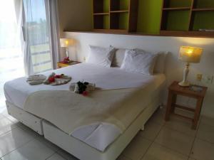 מיטה או מיטות בחדר ב-Refugios Parajuru - Casa Graf