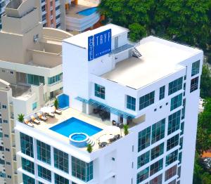 an overhead view of a building with a swimming pool at Tryp by Wyndham Panama Centro in Panama City