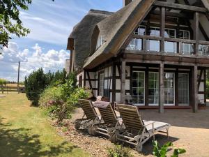 Zahrada ubytování Landhaus am Achterwasser mit Bootssteg