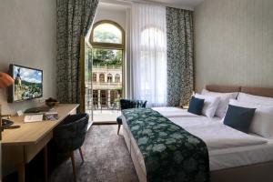 Posteľ alebo postele v izbe v ubytovaní ASTORIA Hotel & Medical Spa