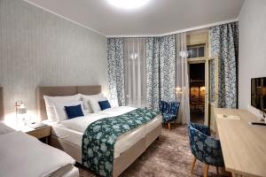 Posteľ alebo postele v izbe v ubytovaní ASTORIA Hotel & Medical Spa
