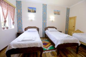 Lova arba lovos apgyvendinimo įstaigoje Polvonnazir Guest House