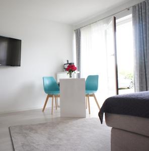 TV a/nebo společenská místnost v ubytování Ferienwohnung Lörrach Alice + 1 fotografie